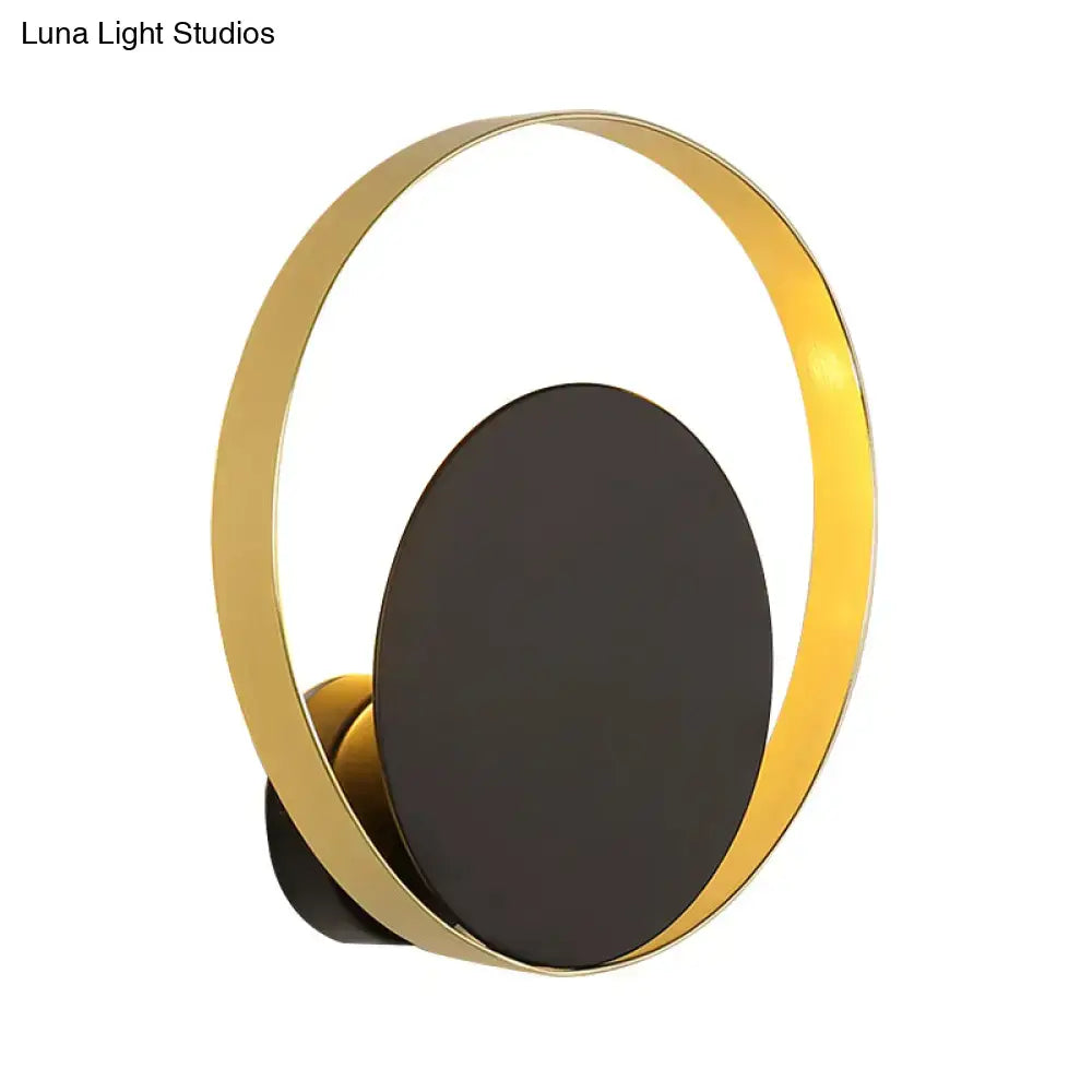 Black Gold Circle Sconce with gold ring around a matte black backplate, modern wall light on Tampa Home & Garden Store