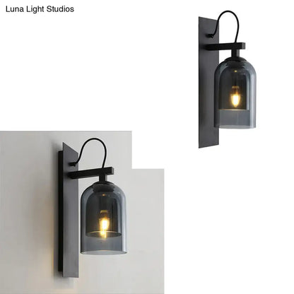 Black smoked glass sconce by Decorbites; matte black wall mount, curved arm, smoky shade on Tampa Home & Garden Store