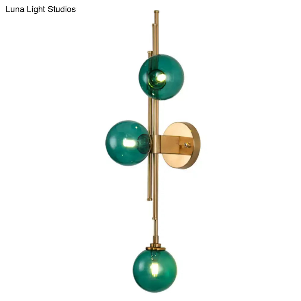 Brass glass orb sconce with three emerald green glass globes and wall mount by Decorbites on Tampa Home & Garden Store