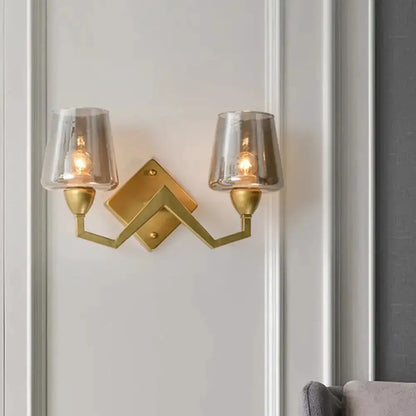 Decorbites two-light mid-century brass wall lamp with truncated cone glass shades on Tampa Home & Garden Store