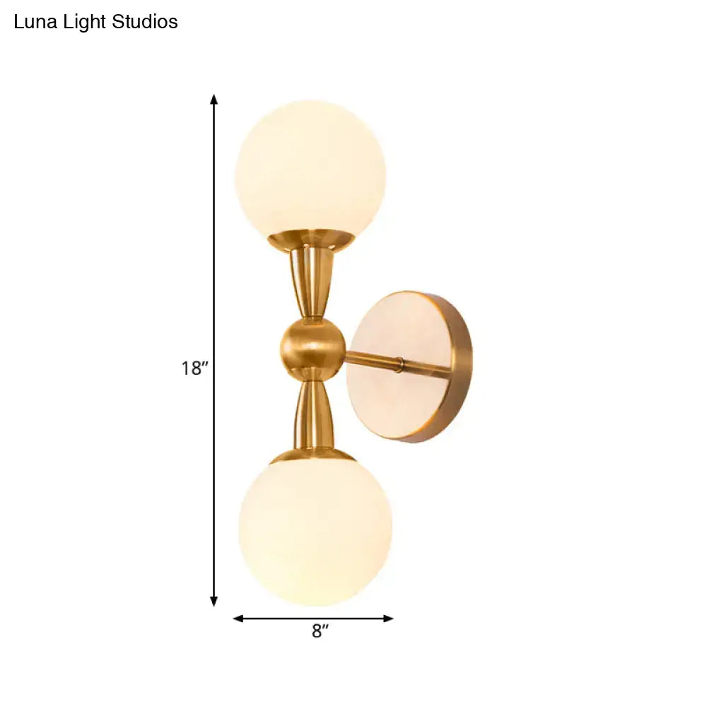 Brass opal glass orb wall sconce with two frosted globes in brass finish by Decorbites on Tampa Home & Garden Store
