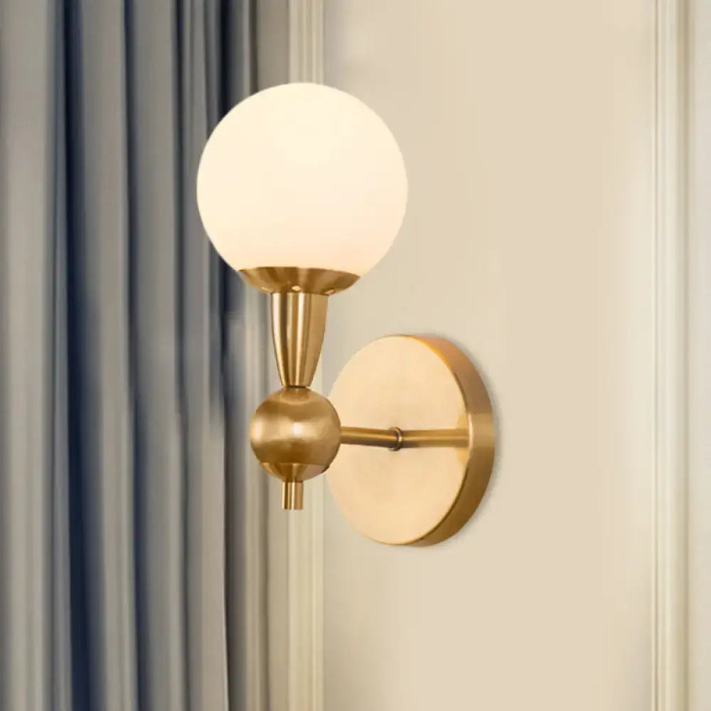 Brass opal glass orb wall sconce, gold finish, Decorbites, round backplate on Tampa Home & Garden Store
