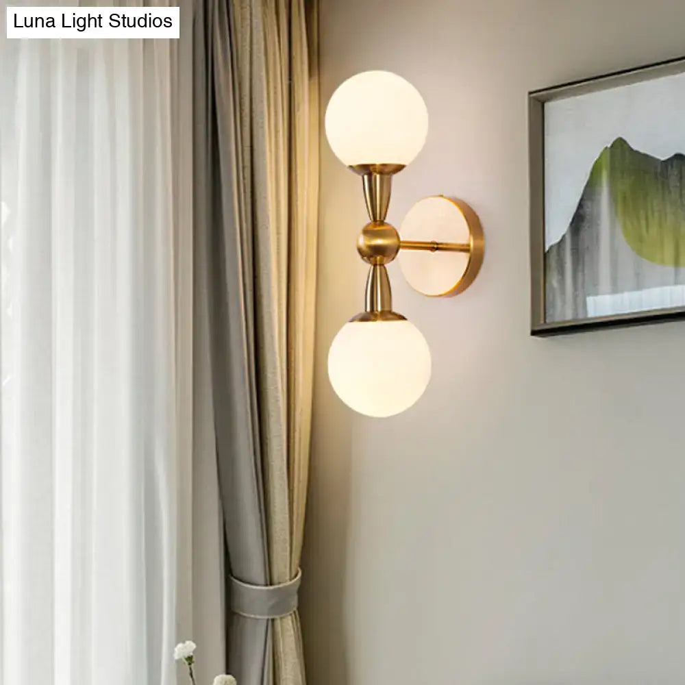 Brass opal glass orb wall sconce with twin globes on brass stem, wall mount by Decorbites on Tampa Home & Garden Store