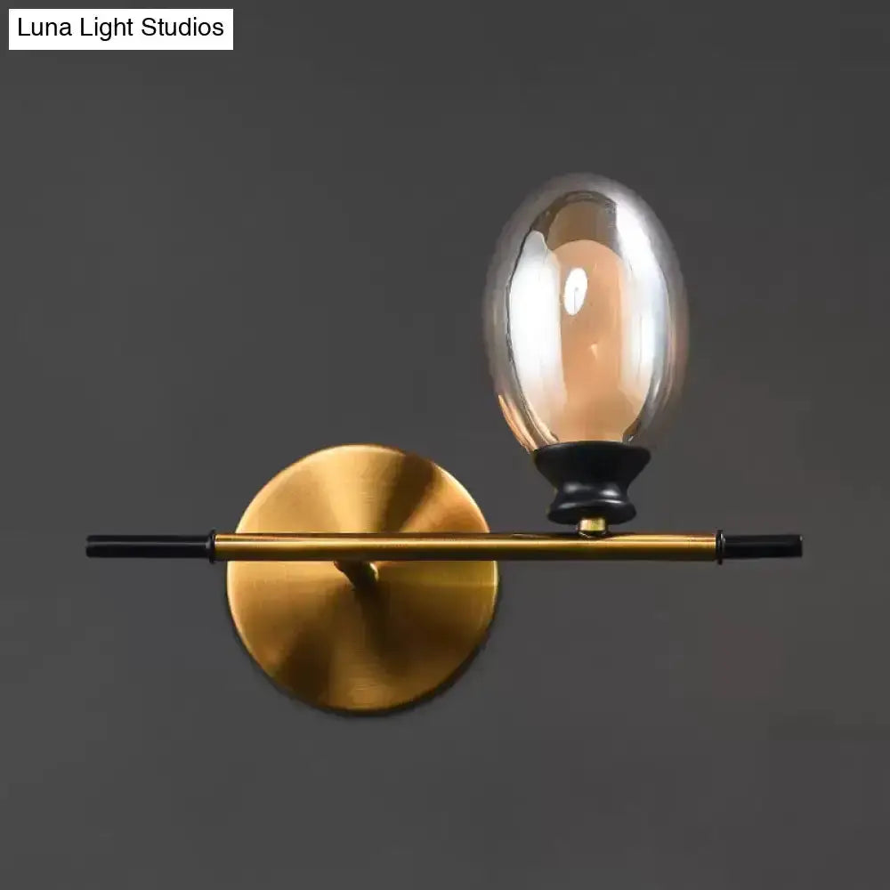 Mid Century Gold and Black Wall Lamp Amber Shade