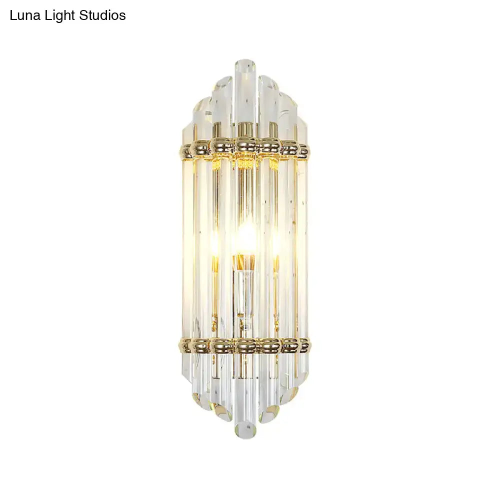 Gold crystal pipe sconce with clear glass rods and gold bands on Tampa Home & Garden Store