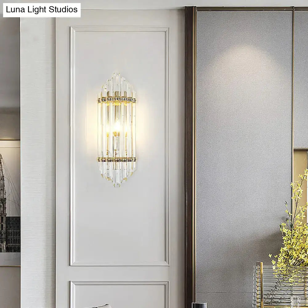 Gold crystal pipe sconce with vertical crystal rods and candle bulb by Decorbites on Tampa Home & Garden Store