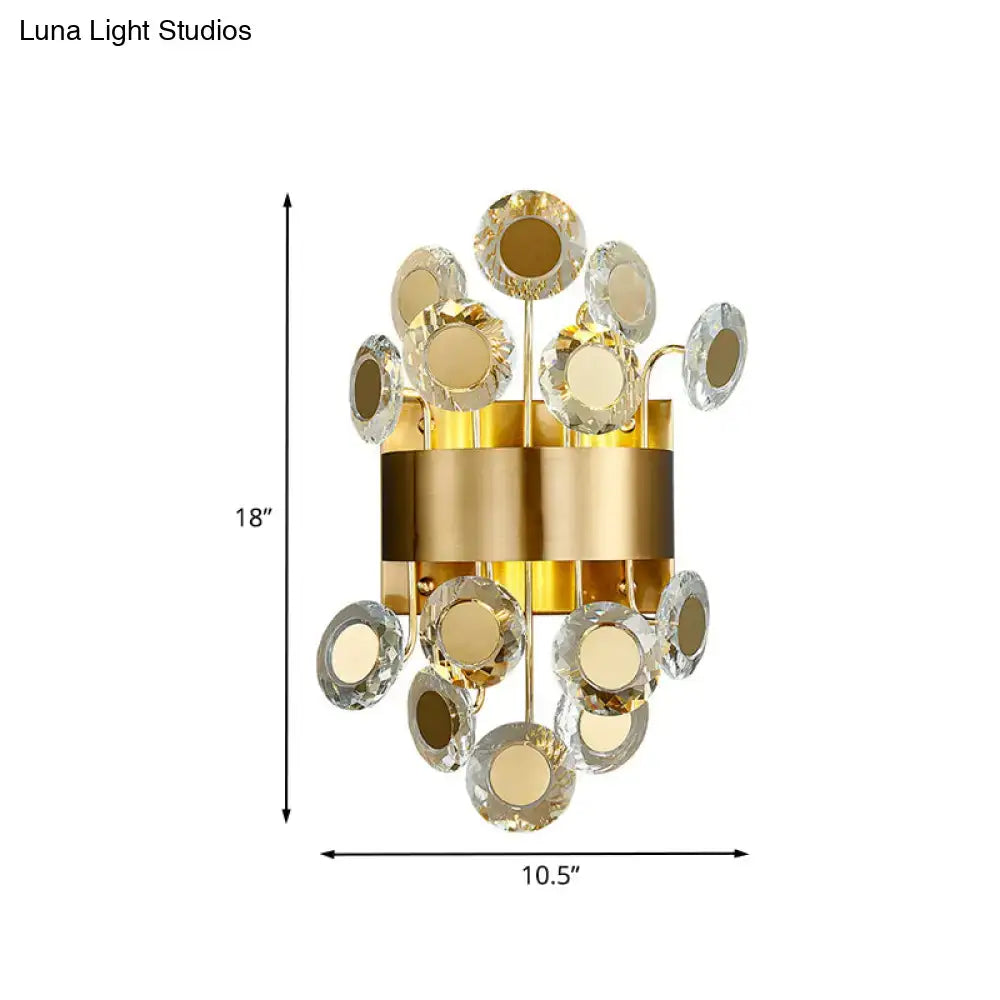 Decorbites gold crystal integrated LED wall light sconce with round crystal discs on a gold band on Tampa Home & Garden Store