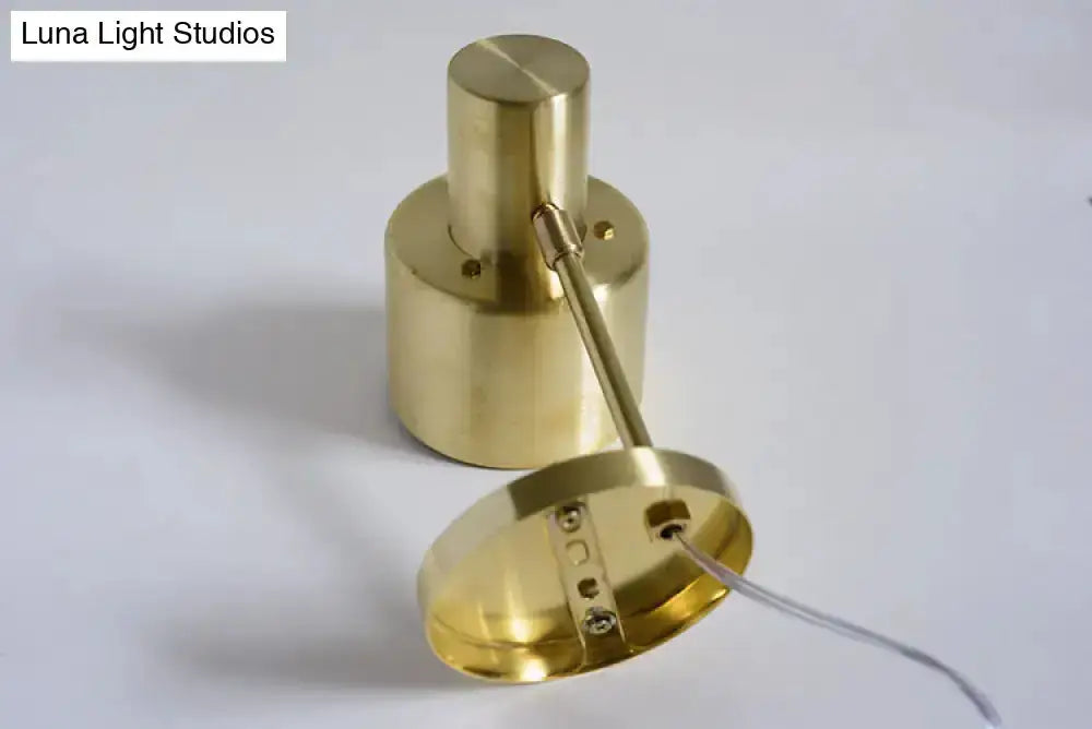 Mid-century gold metal wall sconce components with round ceiling canopy and slim arm on Tampa Home & Garden Store