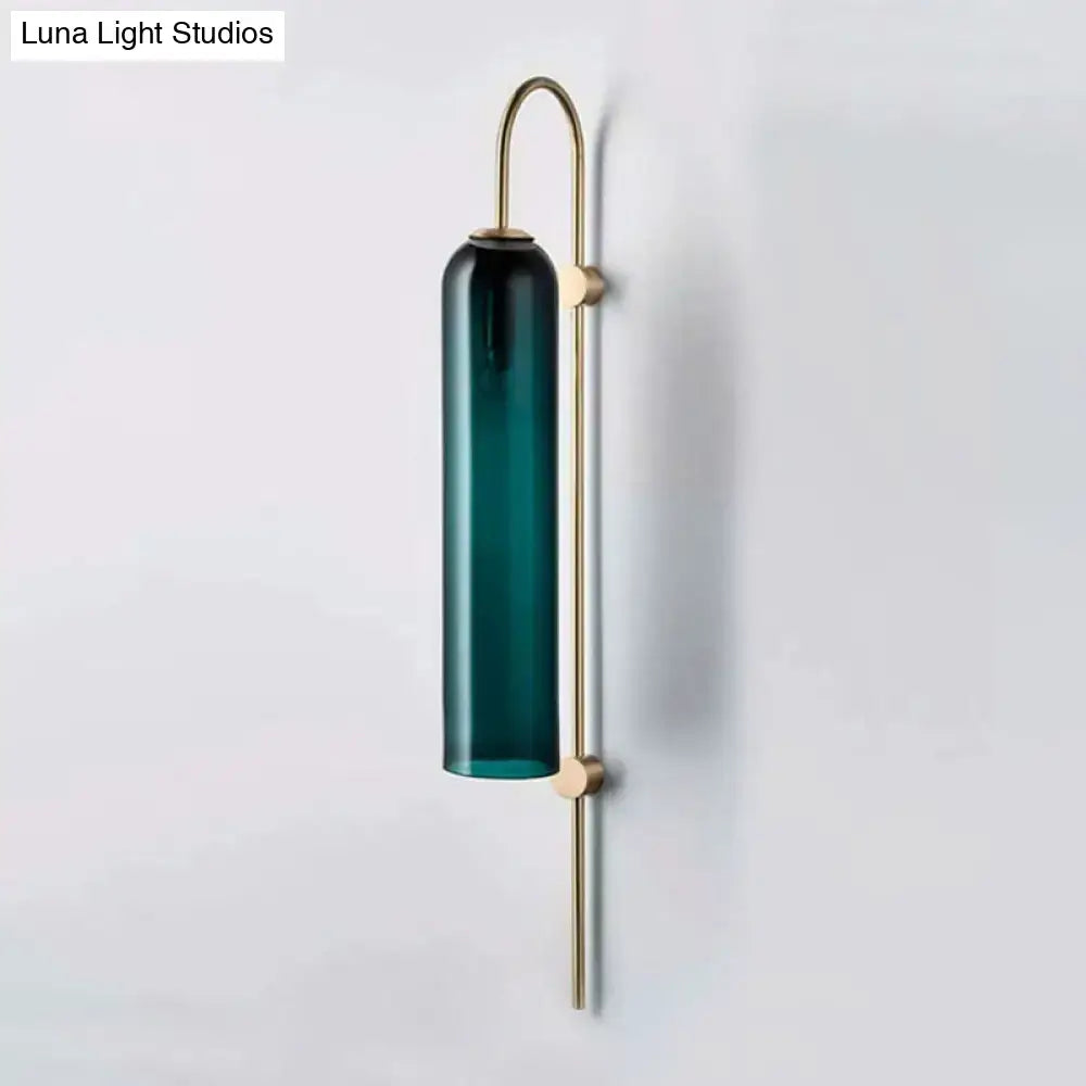 Decorbites brass gooseneck wall sconce with teal glass cylinder on Tampa Home & Garden Store