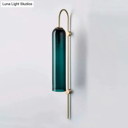 Decorbites brass gooseneck wall sconce with teal glass cylinder on Tampa Home & Garden Store