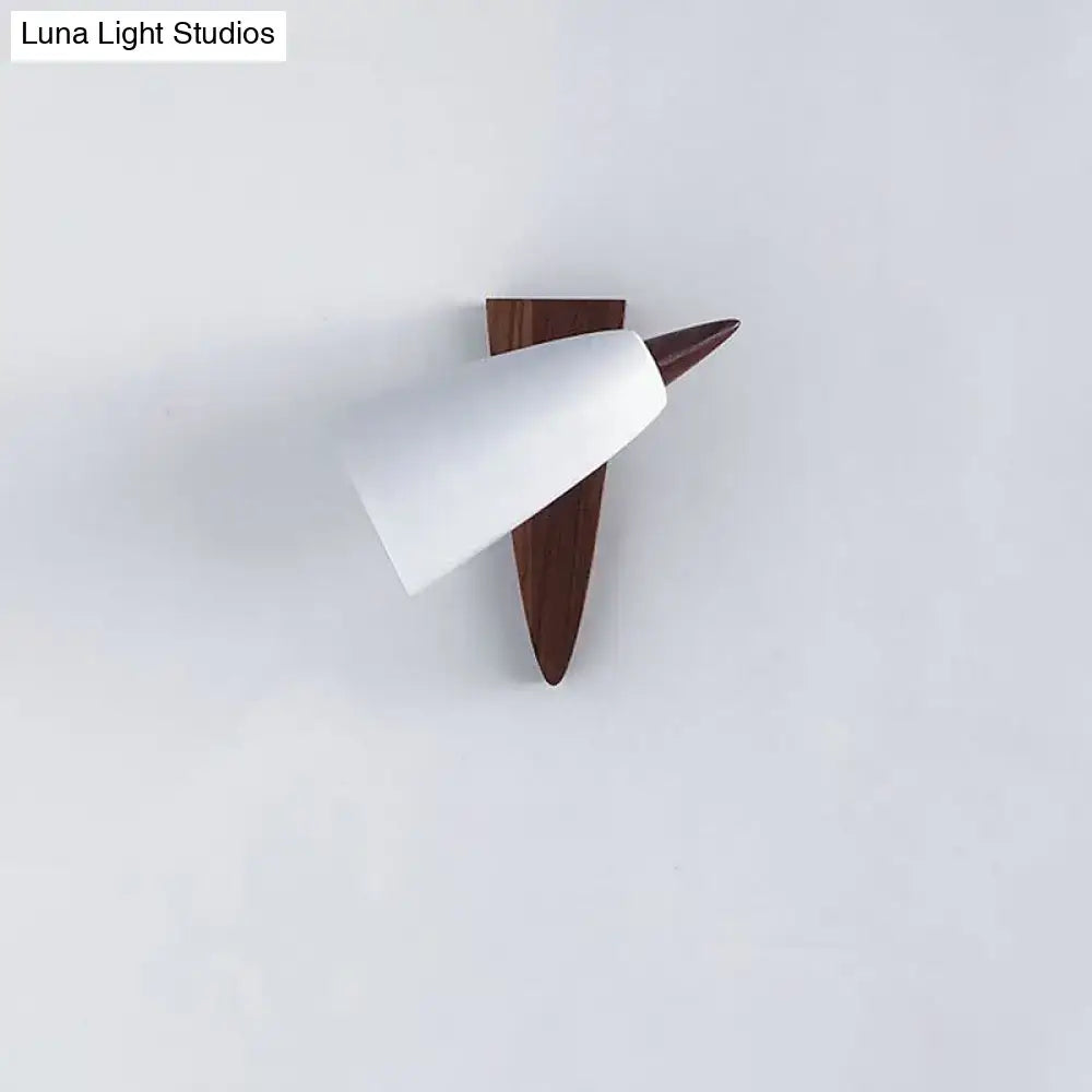 White metal cone wood base sconce mounted on a wall with a brown wood backplate on Tampa Home & Garden Store