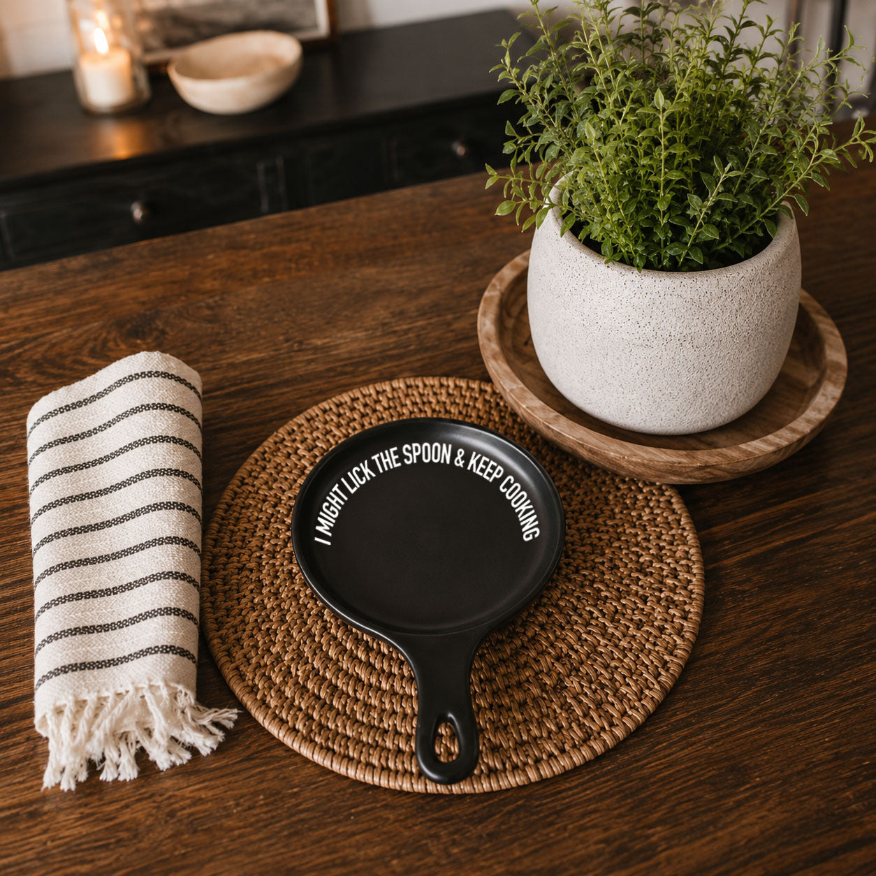 Lick the Spoon & Cook spoon rest by Gia Roma, black round kitchen accessory with white text on Tampa Home & Garden Store