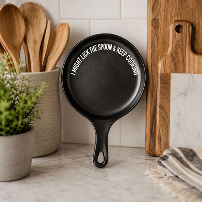 Lick the Spoon & Cook spoon rest, Gia Roma, black skillet-style with white text on Tampa Home & Garden Store