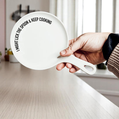 Lick the Spoon & Cook spoon rest by Gia Roma, white ceramic with bold black typography on Tampa Home & Garden Store
