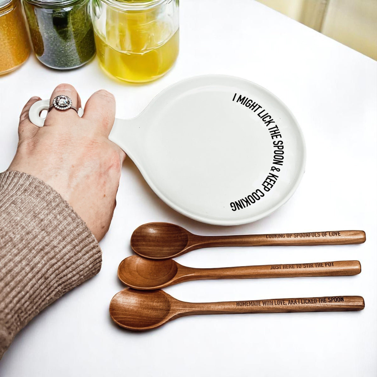 Gia Roma Lick the Spoon & Cook white ceramic spoon rest with rim slogan and three wooden spoons on Tampa Home & Garden Store