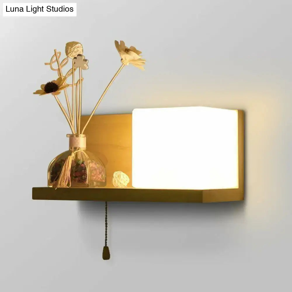 Milk Glass Cube Sconce on warm wooden shelf with Decorbites, soft ambient glow on Tampa Home & Garden Store