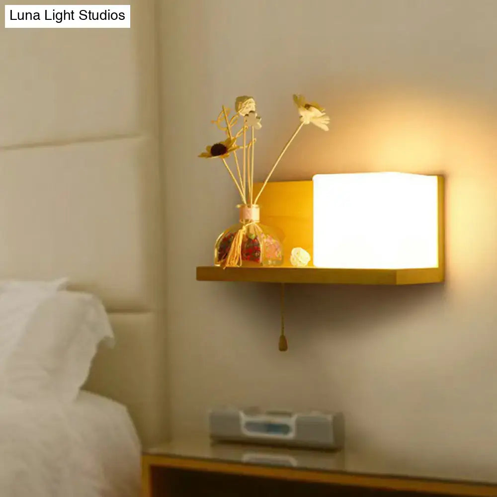 Milk Glass Cube Sconce by Decorbites; warm glow over wooden shelf with dried flower vase on Tampa Home & Garden Store