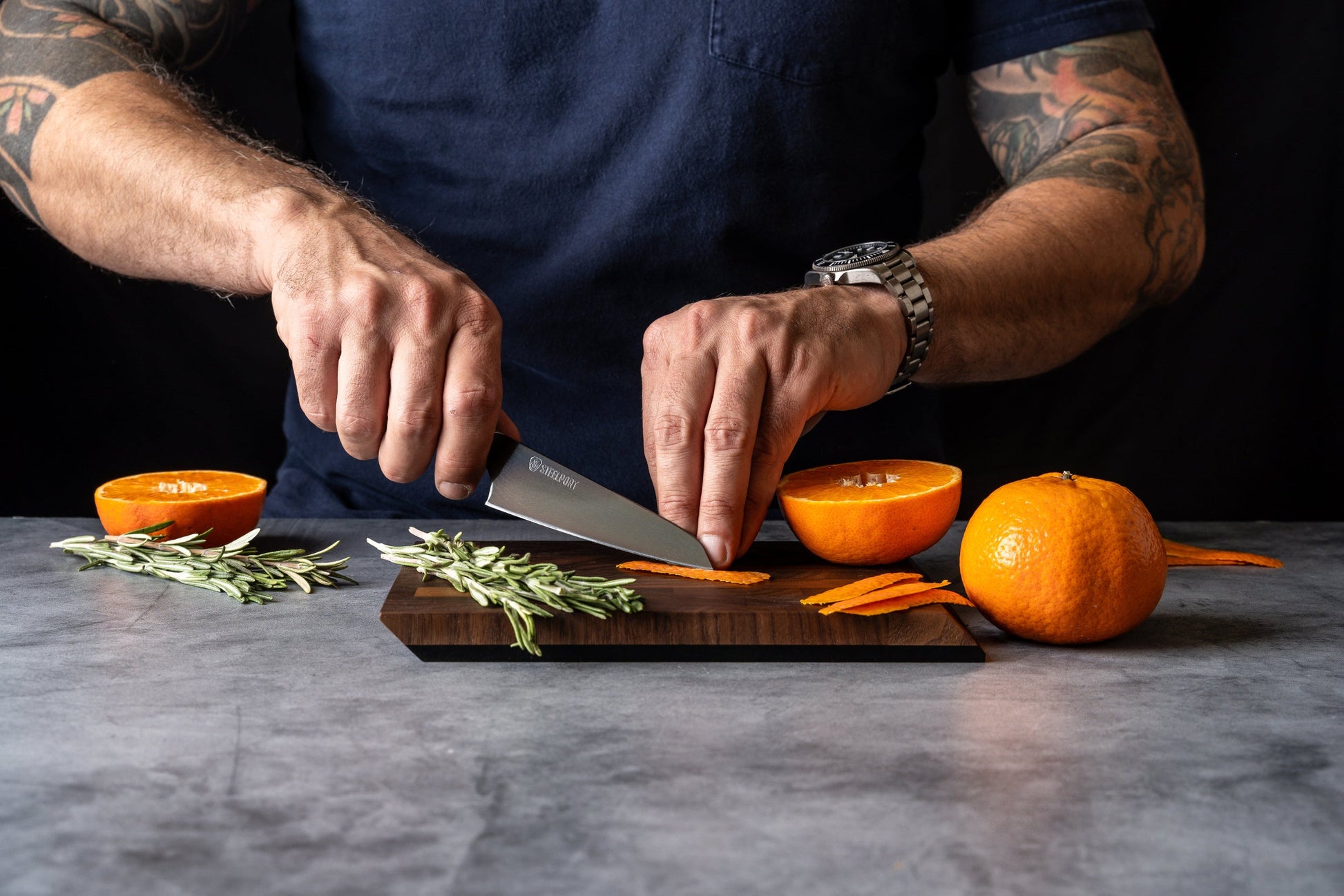 Bar Set knife by STEELPORT Knife Co. stainless blade slicing orange on rosemary garnish on Tampa Home & Garden Store