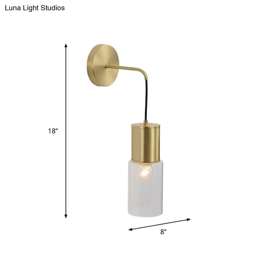 Decorbites brass glass wall sconce with curved arm and cylindrical shade on Tampa Home & Garden Store