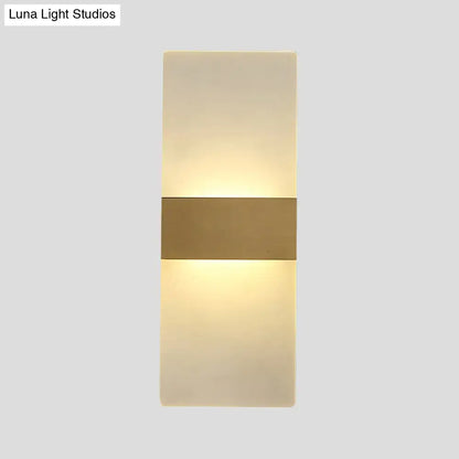 Decorbites gold acrylic direct-wired wall sconce with a horizontal gold band and warm glow on Tampa Home & Garden Store
