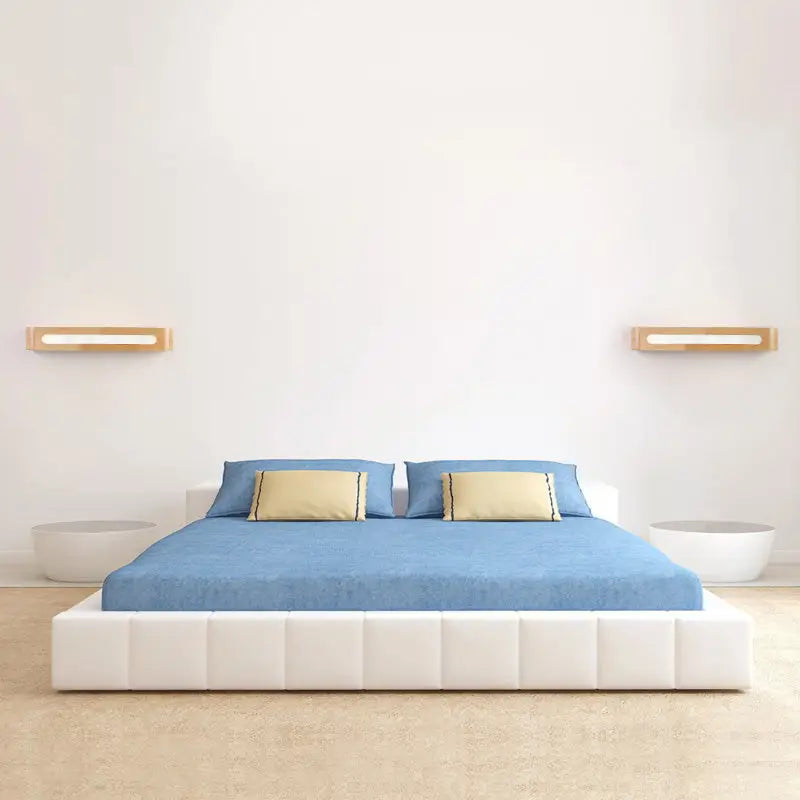 Bamboo LED wall sconces by Decorbites, pair beside blue bed in a minimalist Nordic bedroom on Tampa Home & Garden Store