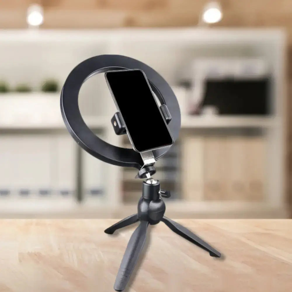 Black metal phone holder with circular ring on a compact tripod stand, Decorbites on Tampa Home & Garden Store