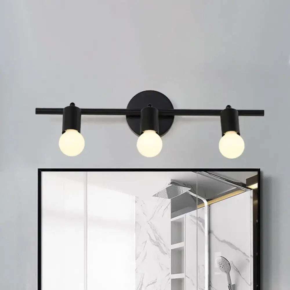 Black metal 3-arm vanity light by Decorbites with frosted bulbs above bathroom mirror on Tampa Home & Garden Store