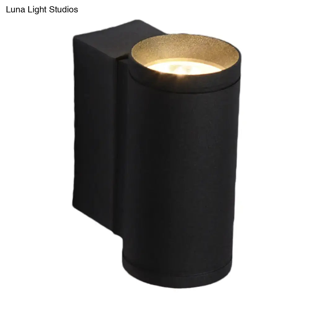 Black metal tubular up-down wall lamp with cylindrical housing and wall mount by Decorbites on Tampa Home & Garden Store