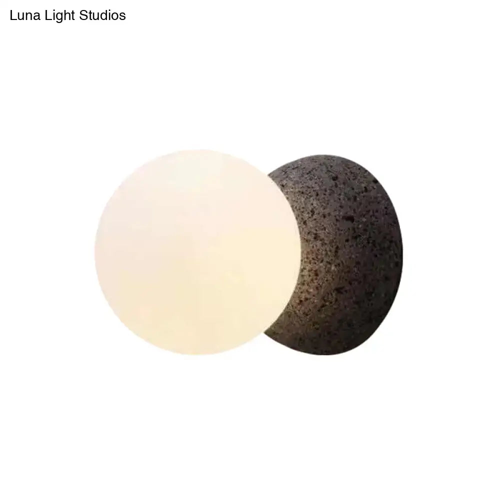 Black glass minimalist LED wall sconce with white glass globe and dark back plate Decorbites on Tampa Home & Garden Store