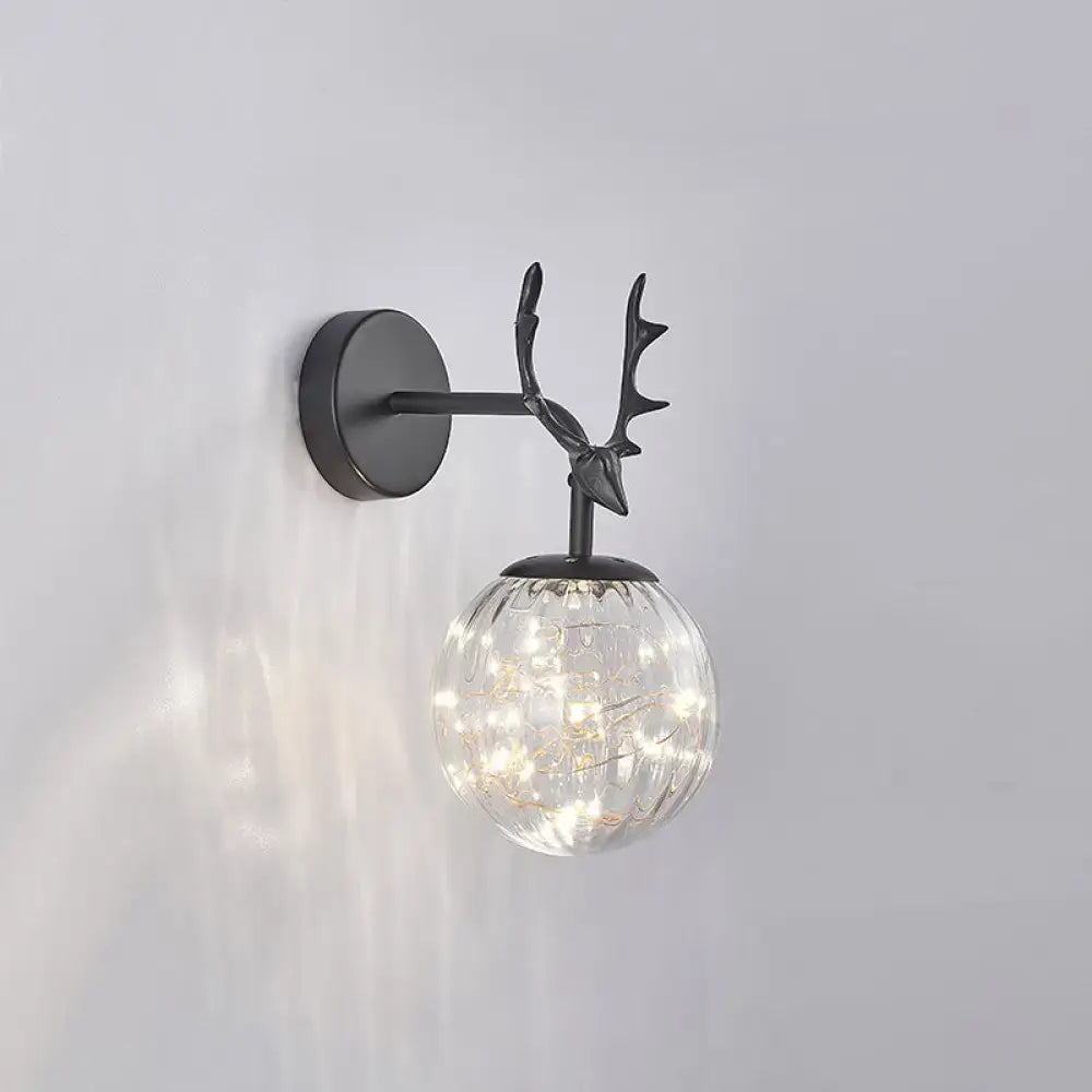 Black Antler Glass Sconce with black metal antler finial and clear glass globe lights Decorbites on Tampa Home & Garden Store