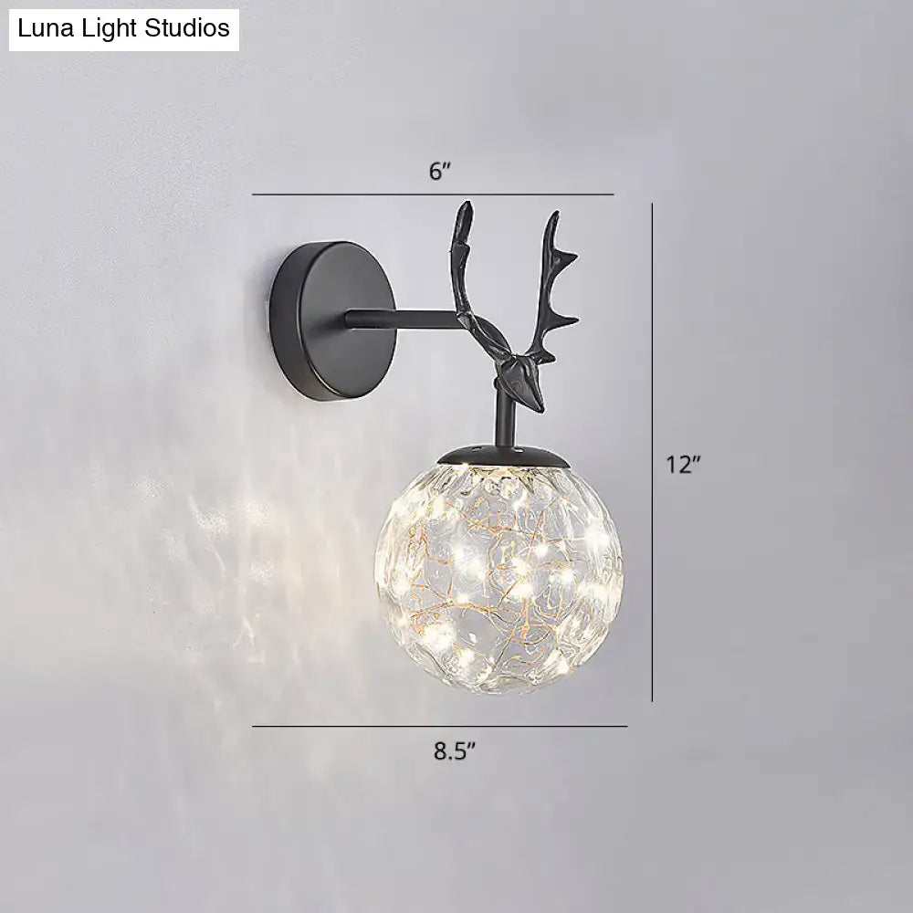 Black antler glass sconce with crackled globe and black metal mount by Luna Light Studios on Tampa Home & Garden Store