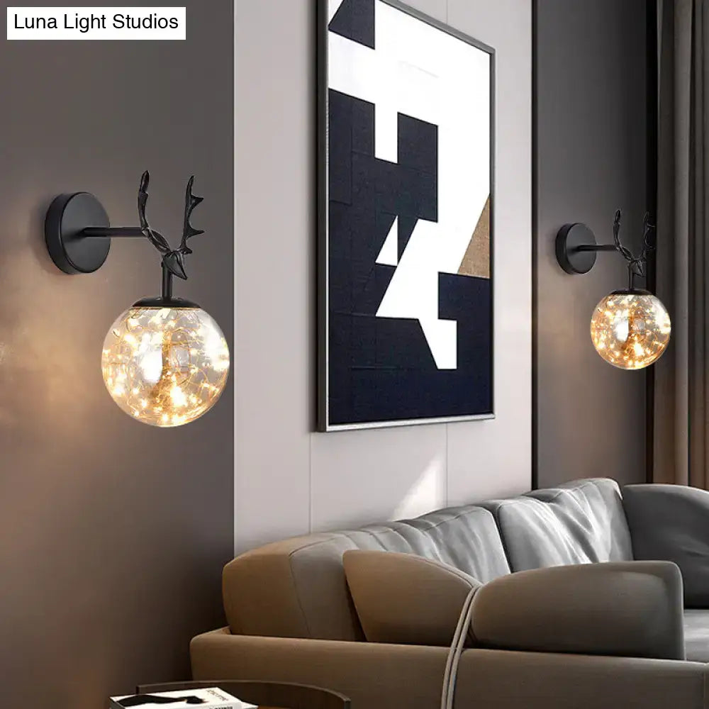 Black Antler Glass Sconces pair by Decorbites; wall-mounted iron with glowing glass globes on Tampa Home & Garden Store