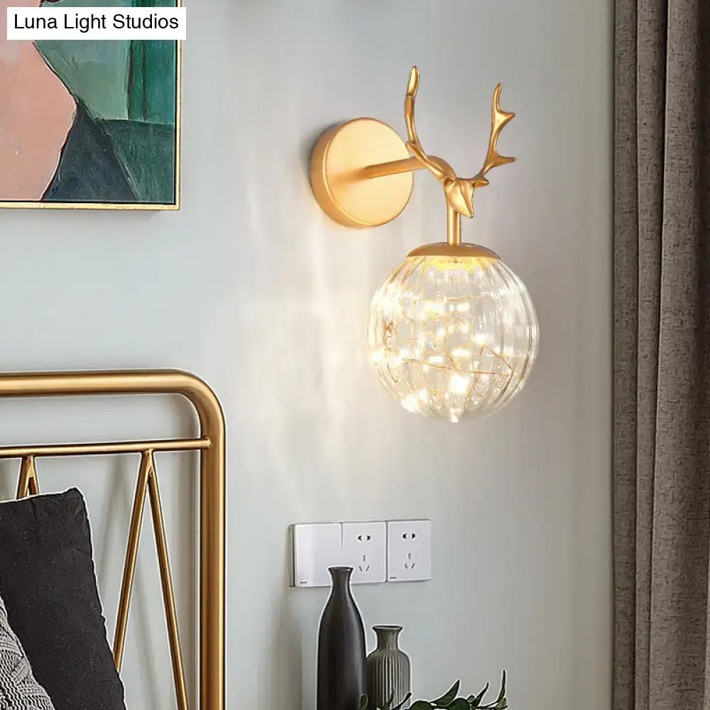 Black Antler Glass Sconce, gold mount with clear glass globe by Decorbites on Tampa Home & Garden Store