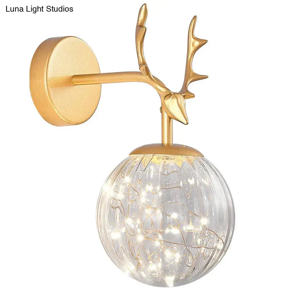 Black Antler Glass Sconce by Decorbites gold antler mount and clear ribbed glass globe on Tampa Home & Garden Store