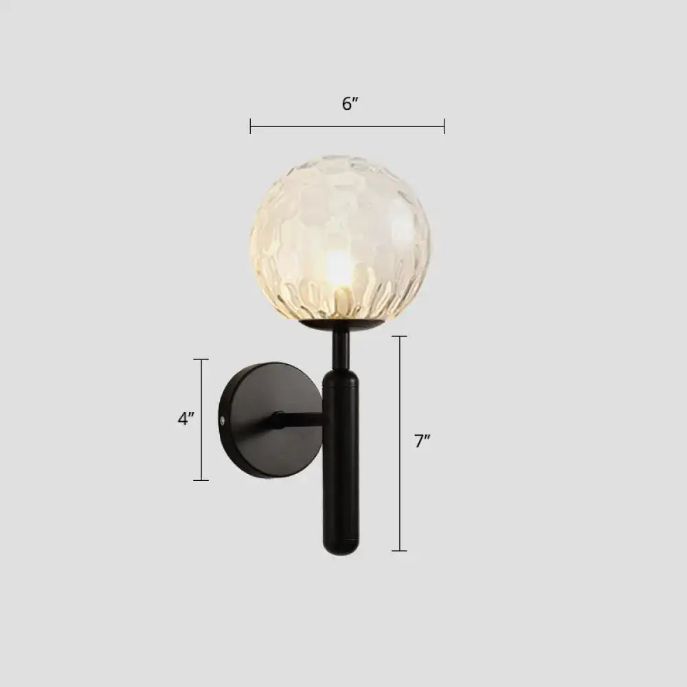 Black Ball Wall Sconce by Decorbites featuring a faceted glass globe and black metal mount on Tampa Home & Garden Store