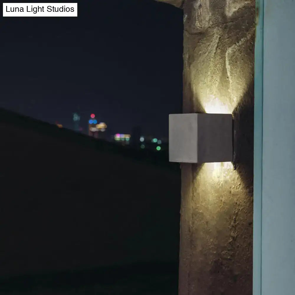 Grey Cement Square Wall Lamp by Decorbites on textured stone wall at night on Tampa Home & Garden Store