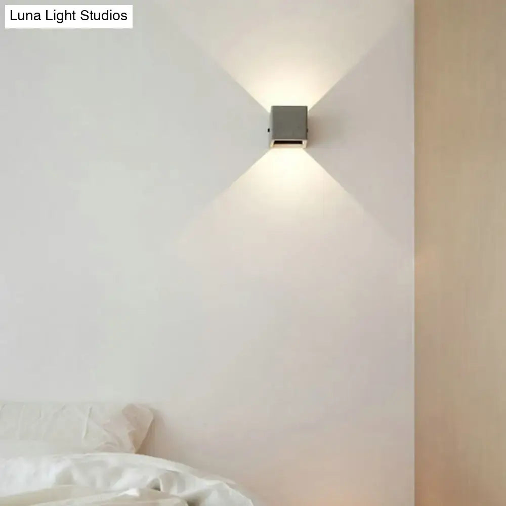 Grey cement square wall lamp by Decorbites mounted on white bedroom wall on Tampa Home & Garden Store