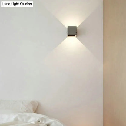 Grey cement square wall lamp by Decorbites mounted on white bedroom wall on Tampa Home & Garden Store