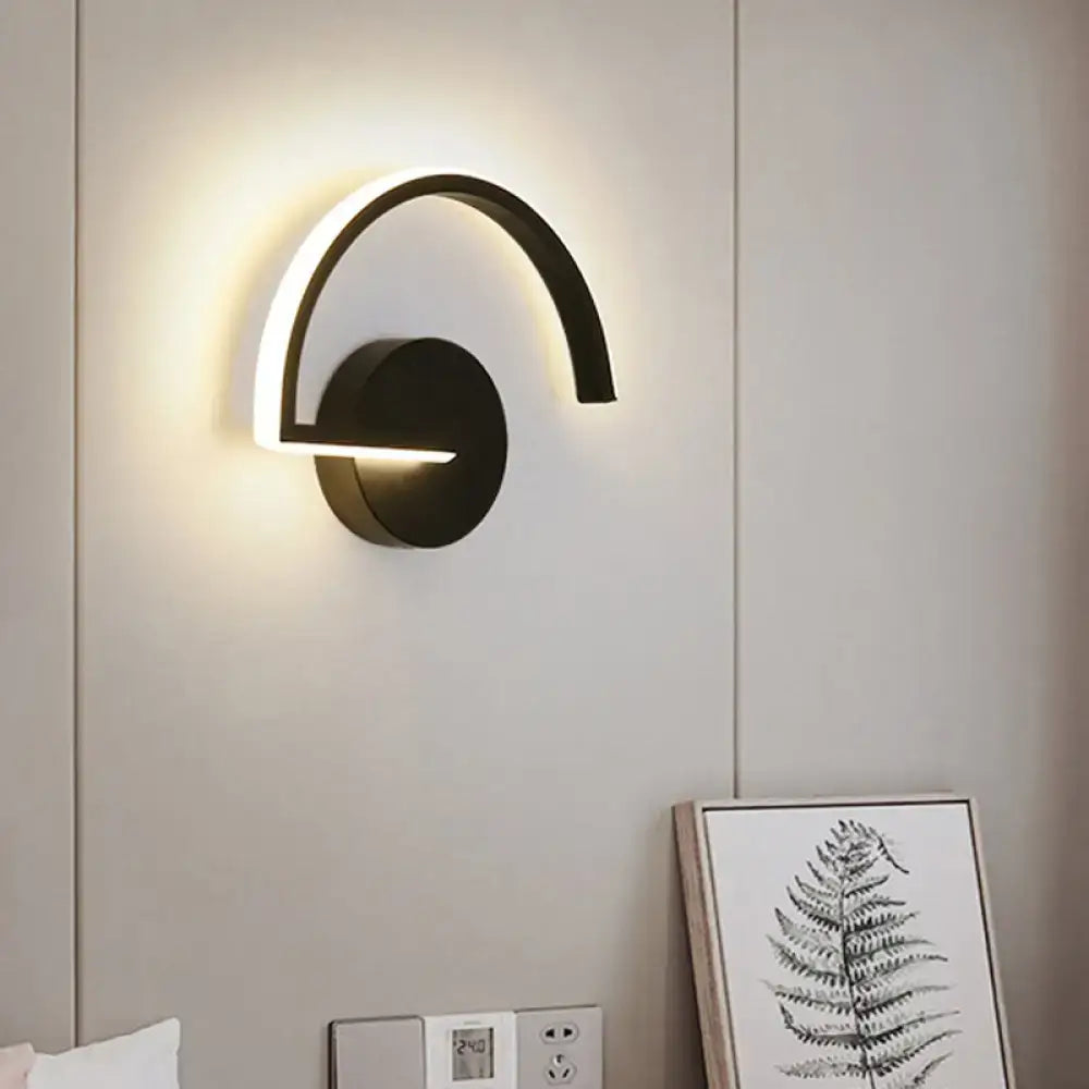 Black Curved Open-Frame Wall Sconce by Decorbites; black metal arc with warm LED light on Tampa Home & Garden Store