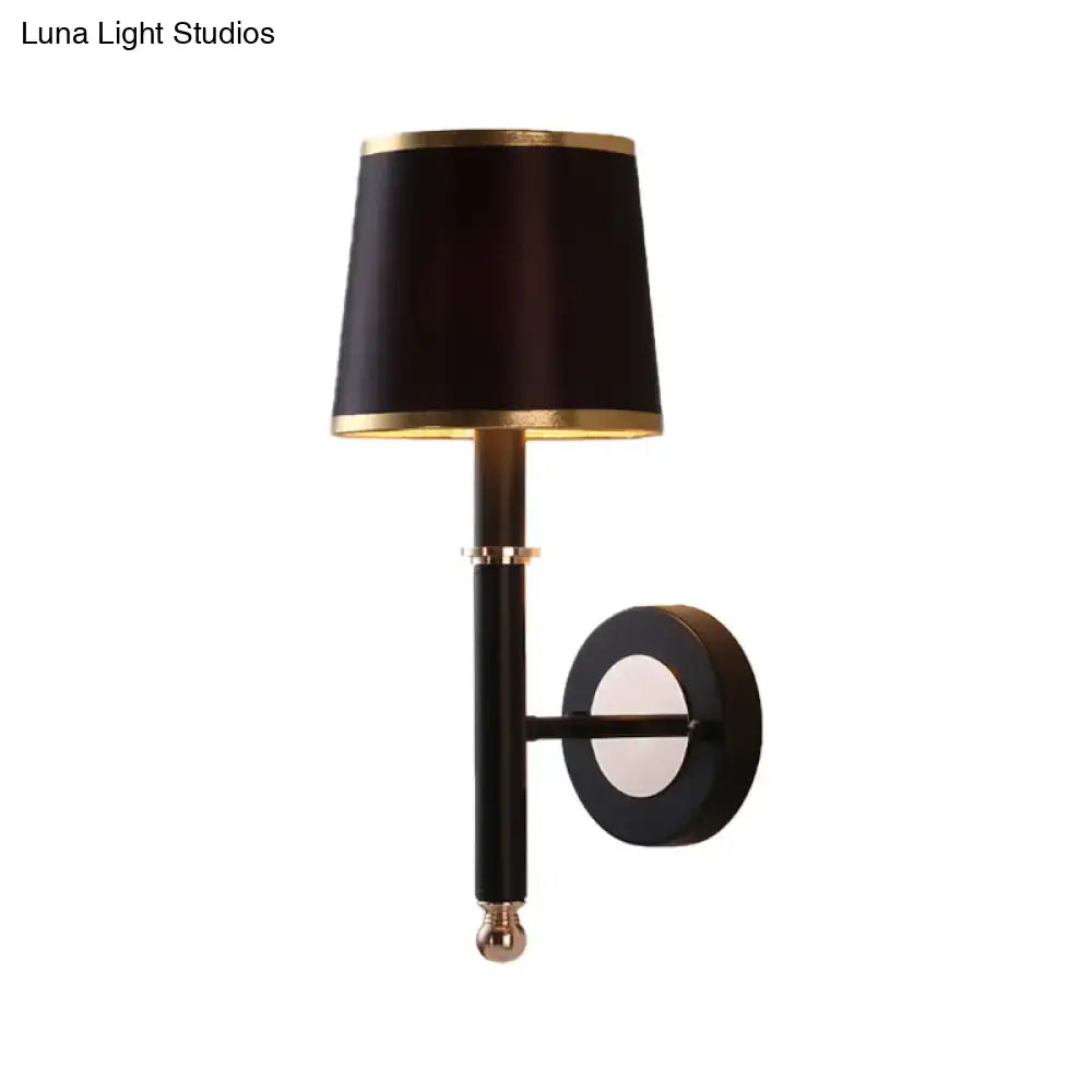 Black flaxen cone wall sconce by Decorbites with gold trim and round wall mount on Tampa Home & Garden Store