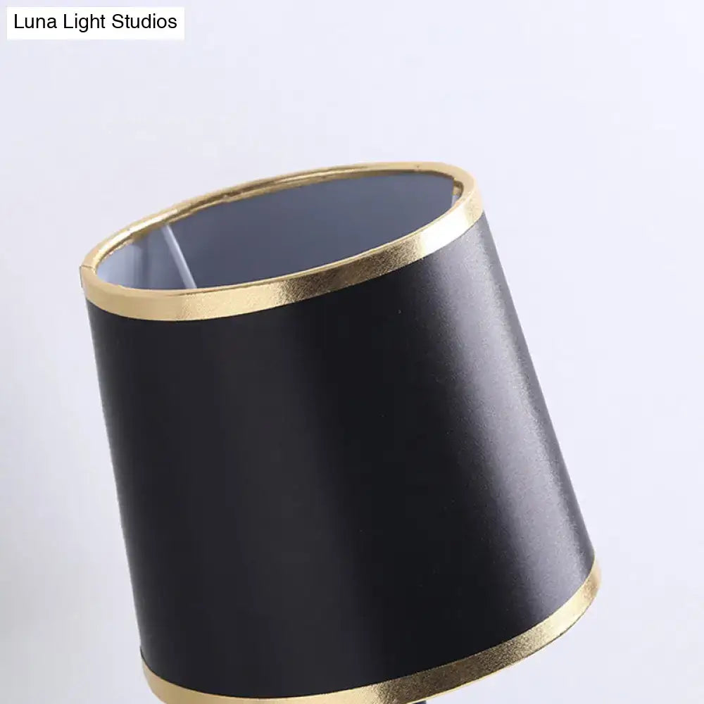 Black flaxen cone wall sconce with gold trim by Decorbites; Luna Light Studios watermark on Tampa Home & Garden Store