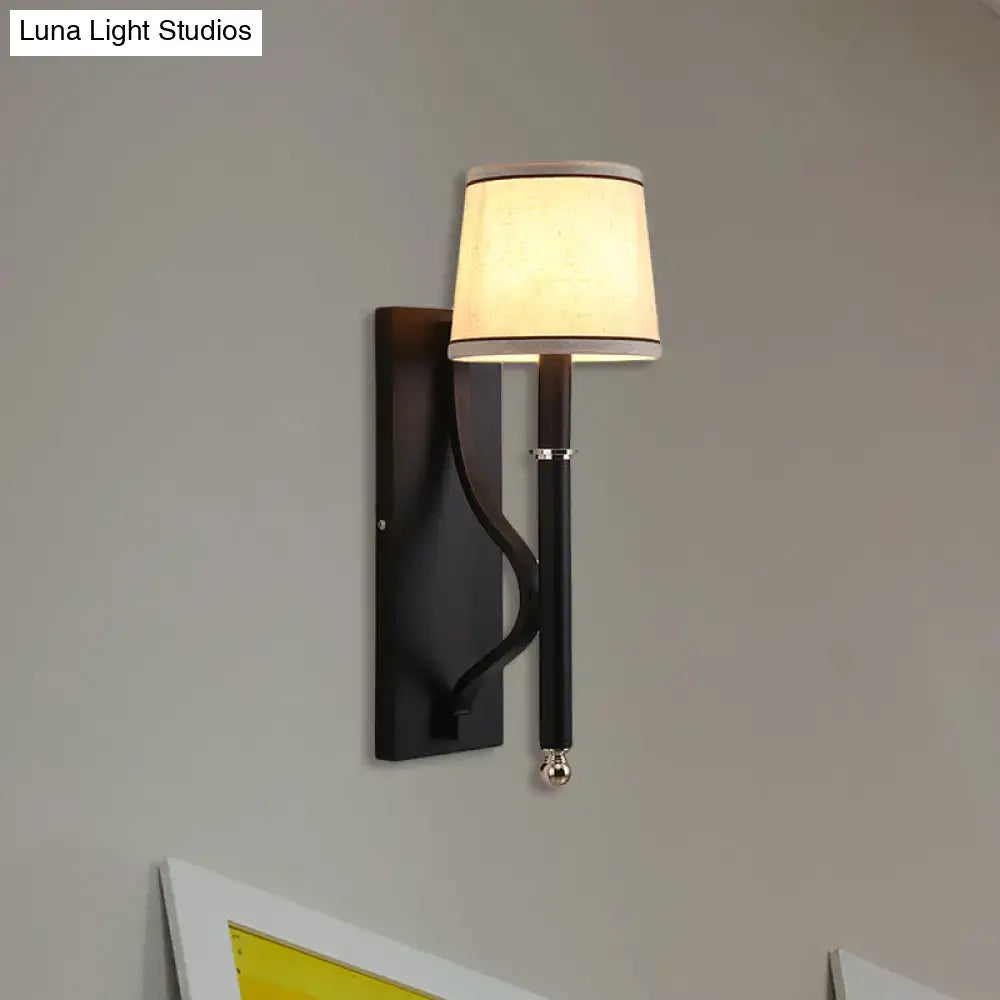 Black flaxen cone wall sconce with beige shade and pull chain on Tampa Home & Garden Store