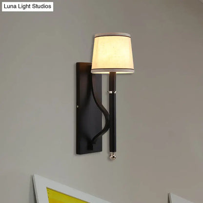 Black flaxen cone wall sconce with beige shade and pull chain on Tampa Home & Garden Store