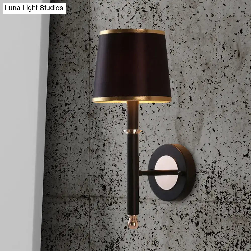 Black Flaxen Cone Wall Sconce by Decorbites with black shade and gold trim wall-mounted on Tampa Home & Garden Store