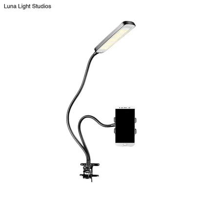 Minimalist black LED desk lamp with flexible gooseneck clamp and phone holder on Tampa Home & Garden Store