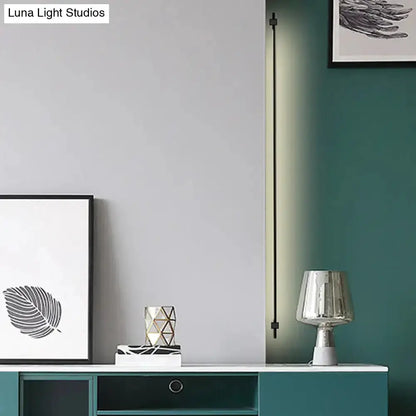 Minimalist Black and Gold Feather Wing Wall Lamp