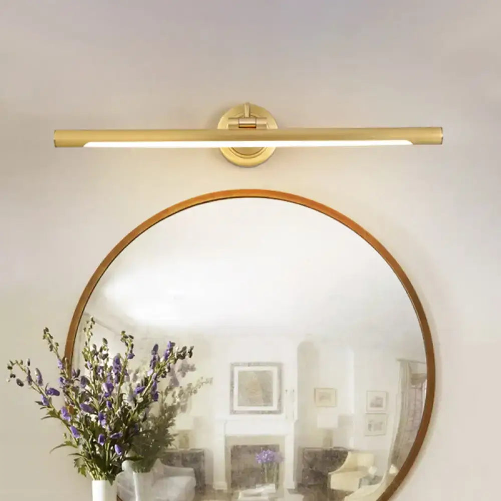 Black Gold Adjustable Sconce by Decorbites brass wall light above a round mirror on Tampa Home & Garden Store