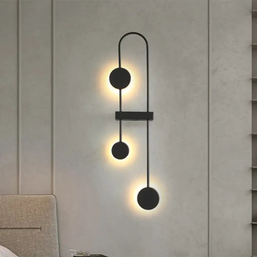 Black Gold Arched Sconce by Decorbites, black metal wall light with three discs and warm glow on Tampa Home & Garden Store