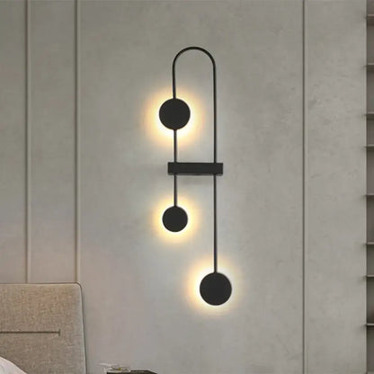 Black Gold Arched Sconce by Decorbites, black metal wall light with three discs and warm glow on Tampa Home & Garden Store