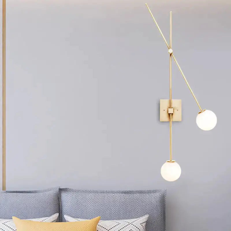 Minimalist black & gold opal glass bubble sconce with two globes on vertical gold rod on Tampa Home & Garden Store
